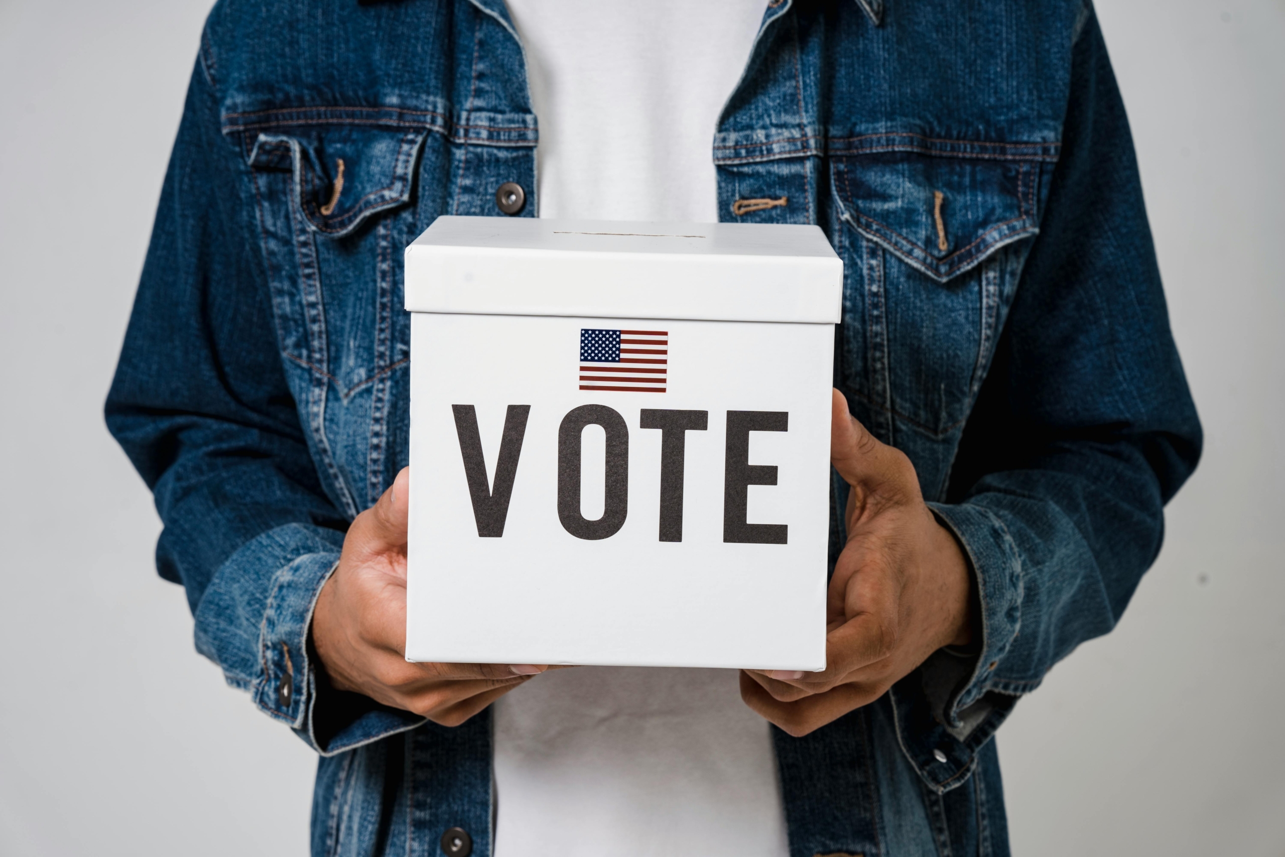 https://www.pexels.com/photo/a-person-holding-a-ballot-box-5926296/
