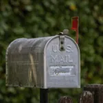 https://www.pexels.com/photo/classic-u-s-mailbox-in-a-green-garden-setting-33839270/